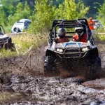 Two people in a ATV